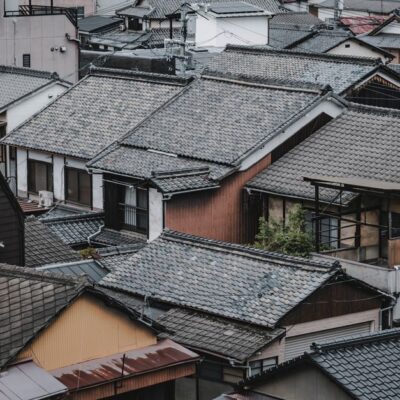 Aerial view of traditional Japanese rooftops in Kurashiki, Japan, showcasing architectural charm.