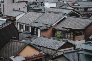 Aerial view of traditional Japanese rooftops in Kurashiki, Japan, showcasing architectural charm.
